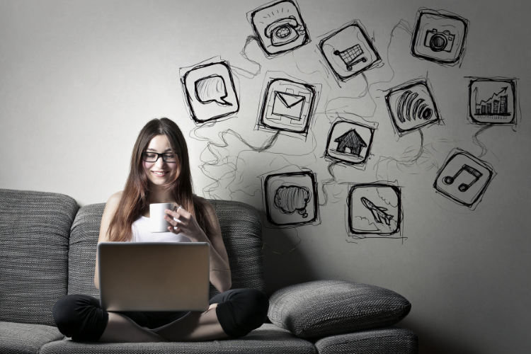 girl sitting with laptop on couch