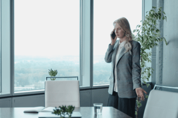 Woman In A Gray Blazer Talking On The Phone